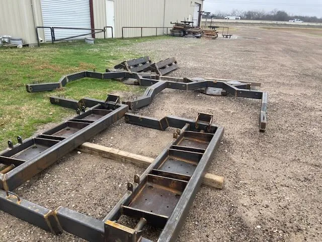 Rusty weathered industrial transport frames before powder coating