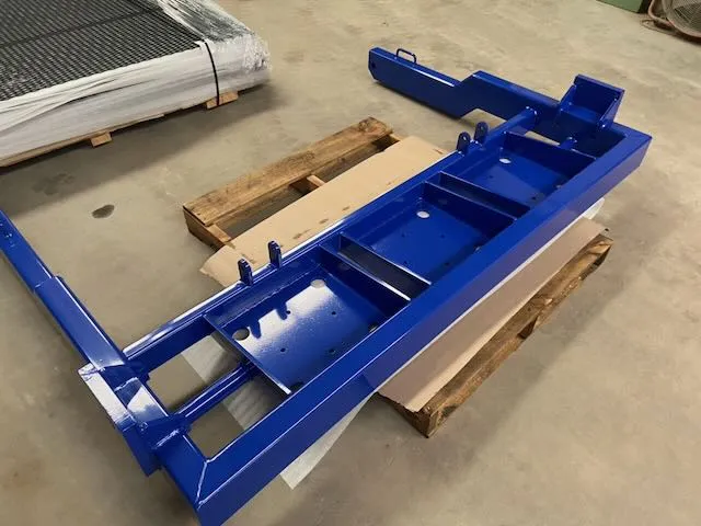 Vibrant blue powder coated transport frames after restoration