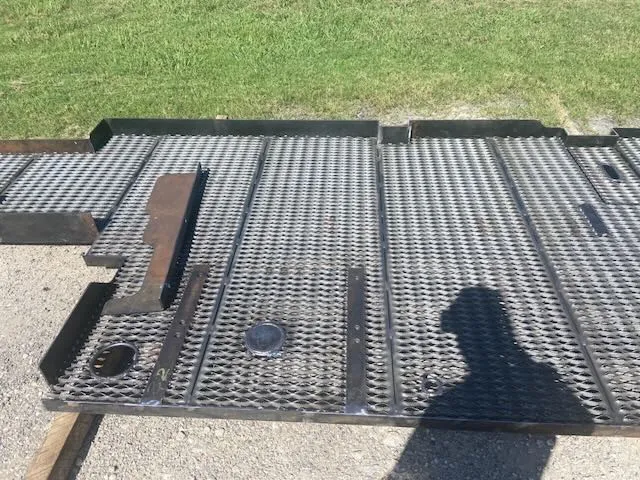 Finished dark gray mesh panels on pallets outdoors