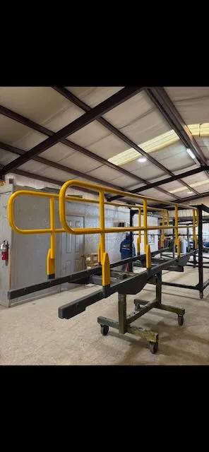 Bright safety yellow walkway railing system after powder coating